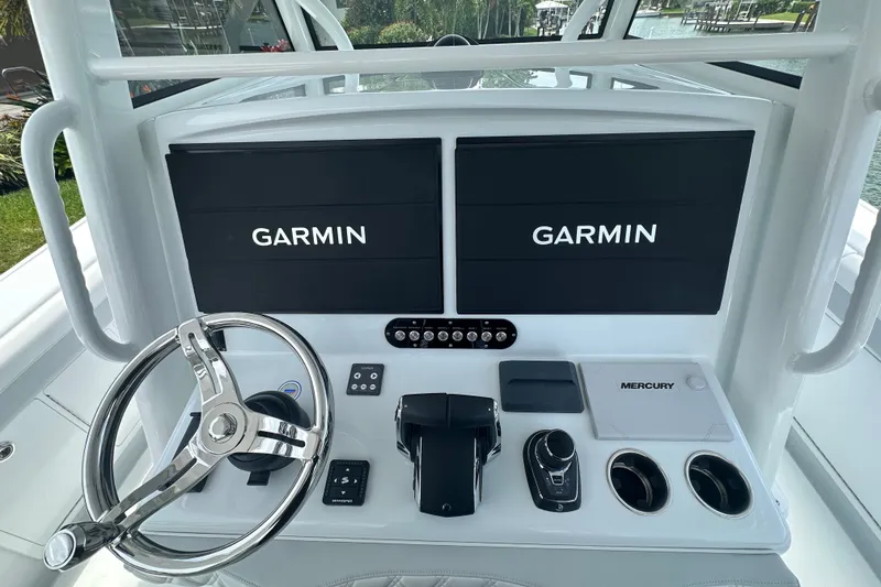 Slide: The Image of 2026 Yellowfin 39 Offshore helm with dual Garmin displays and Mercury controls. - 40