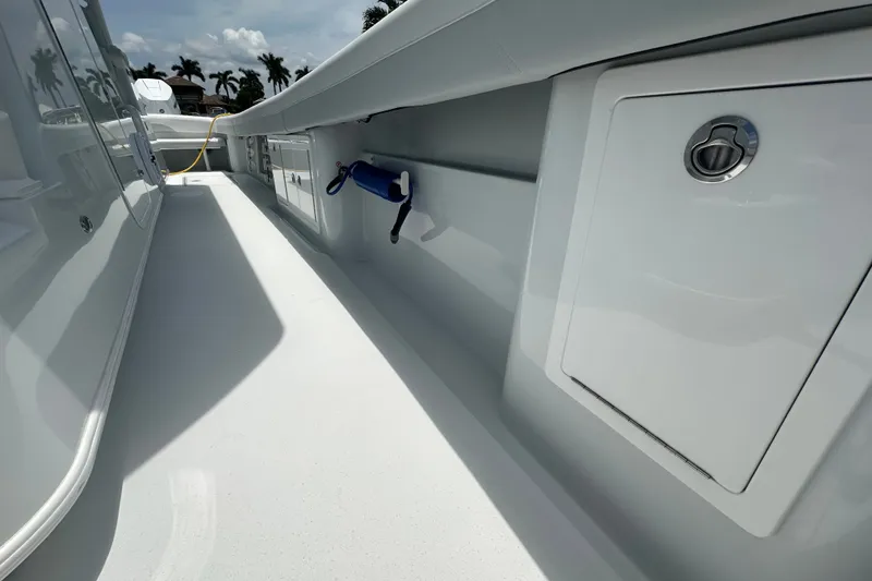 Slide: The Image of 2026 Yellowfin 39 Offshore boat deck with storage compartments and clean design. - 36