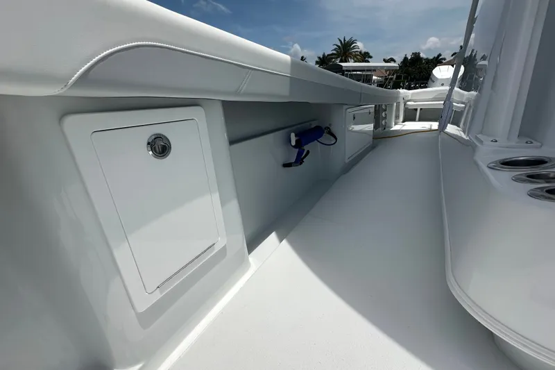 Slide: The Image of 2026 Yellowfin 39 Offshore boat deck with storage compartment and cup holders. - 37