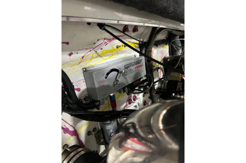 Slide: The Image of Engine compartment of a 1999 Shockwave 21LS boat with Superfuel Valve system. - 15