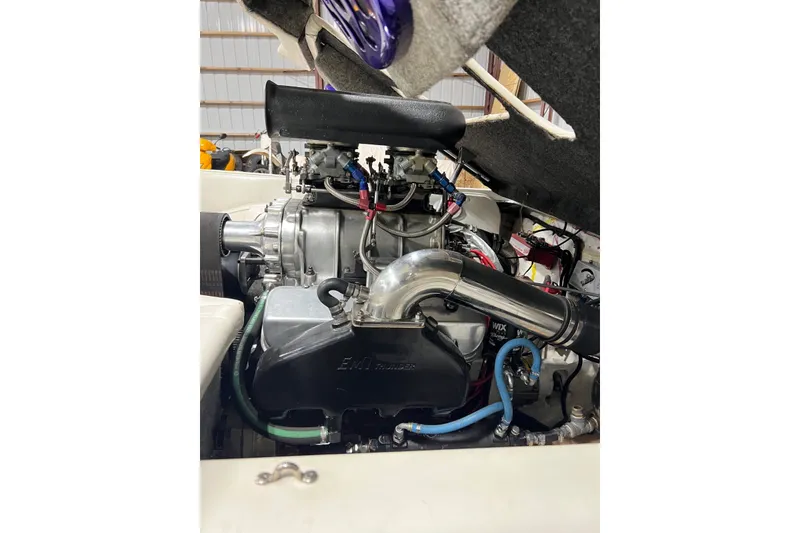 Slide: The Image of Engine of a 1999 Shockwave 21LS boat, showcasing detailed components and wiring. - 18