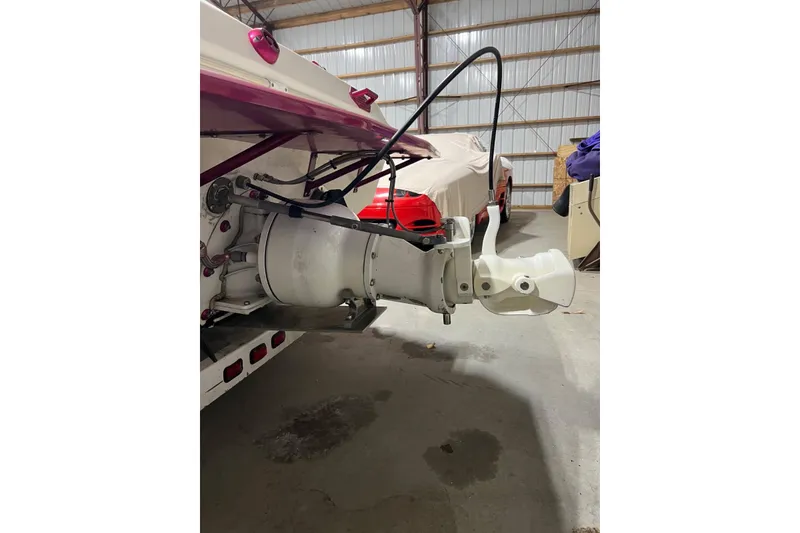 Slide: The Image of Rear view of a 1999 Shockwave 21LS boat in a storage facility. - 19