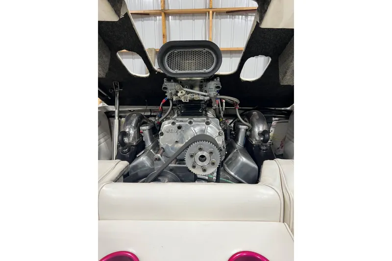 Slide: The Image of 1999 Shockwave 21LS boat engine with Weiand supercharger in a garage setting. - 4