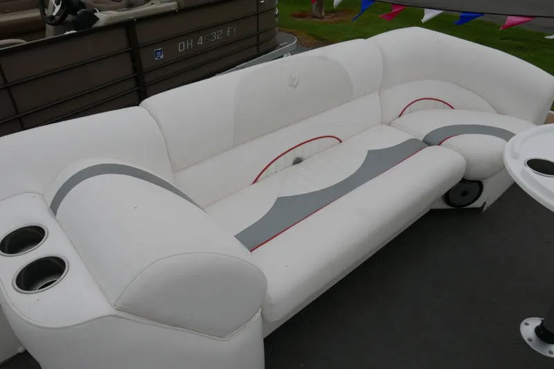 Slide: The Image of White seating area on a 2011 JC 23 SunLounger TT boat with cup holders. - 5
