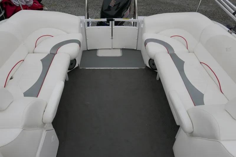 Slide: The Image of Interior of 2011 JC 23 SunLounger TT pontoon boat with white and gray seating. - 11