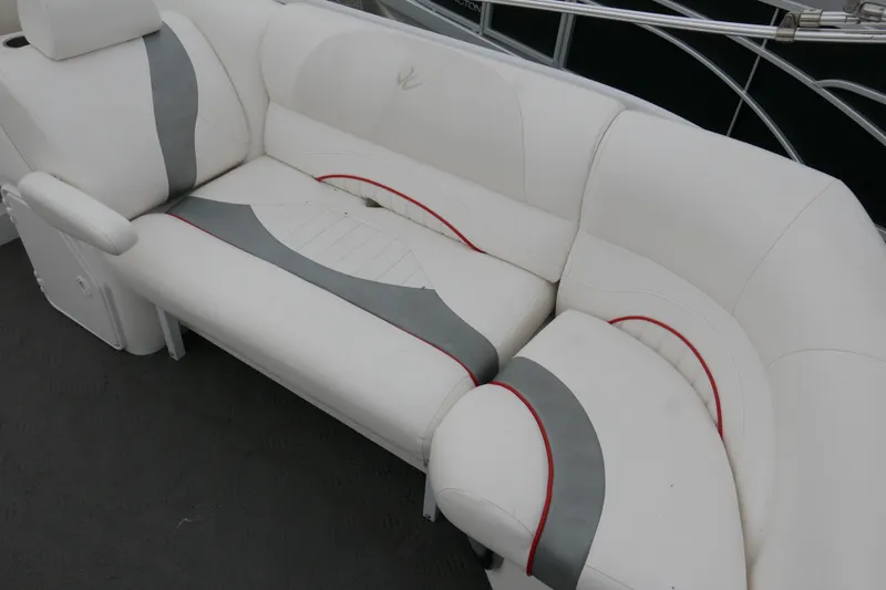 Slide: The Image of White and gray seating on 2011 JC 23 SunLounger TT boat, featuring red accents. - 13