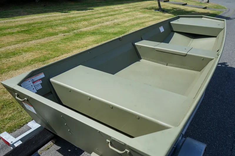 Slide: The Image of 2025 Lund 1648M boat on trailer, showcasing spacious interior and durable design. - 5