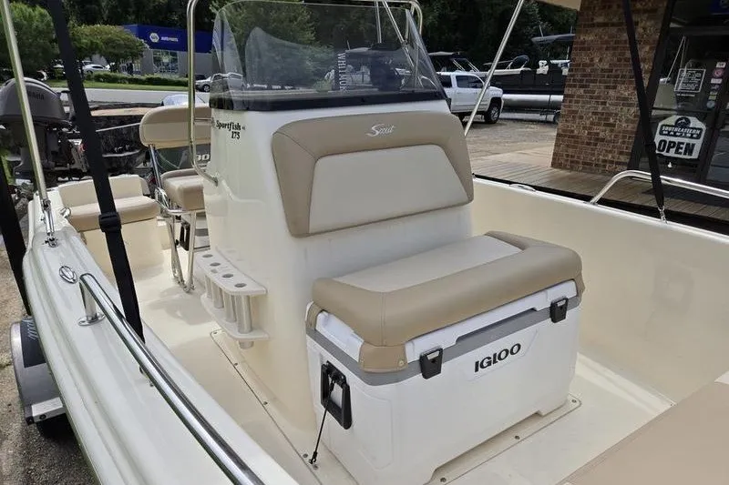 Slide: The Image of 2025 Scout 175 Sportfish boat interior with seating and Igloo cooler. - 15