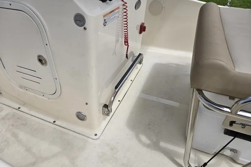 Slide: The Image of Interior of 2025 Scout 175 Sportfish boat showing seating and control panel. - 3