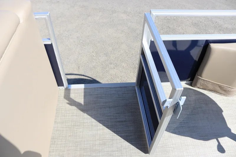 Slide: The Image of Open gate on 2025 Sun Chaser Vista Fish 18 pontoon boat, beige and blue interior. - 15