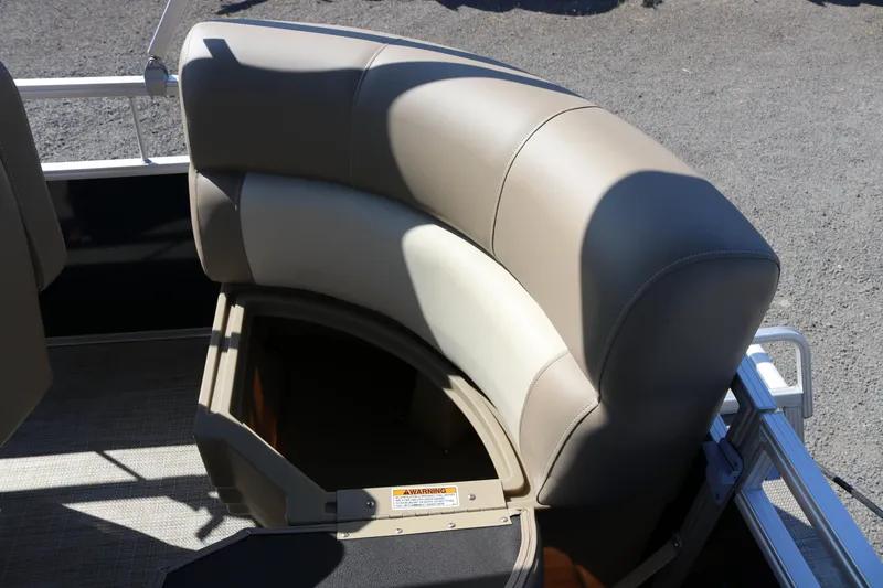 Slide: The Image of 2025 Sun Chaser Vista Fish 18 boat seat with storage compartment open. - 8