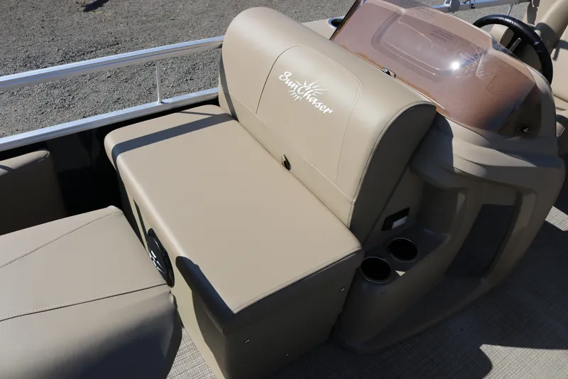 Slide: The Image of 2025 Sun Chaser Vista Fish 18 boat interior with beige seating and cup holders. - 13