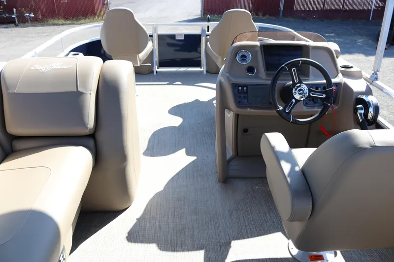 Slide: The Image of Interior of 2025 Sun Chaser Vista Fish 18 boat with beige seating and modern dashboard. - 19