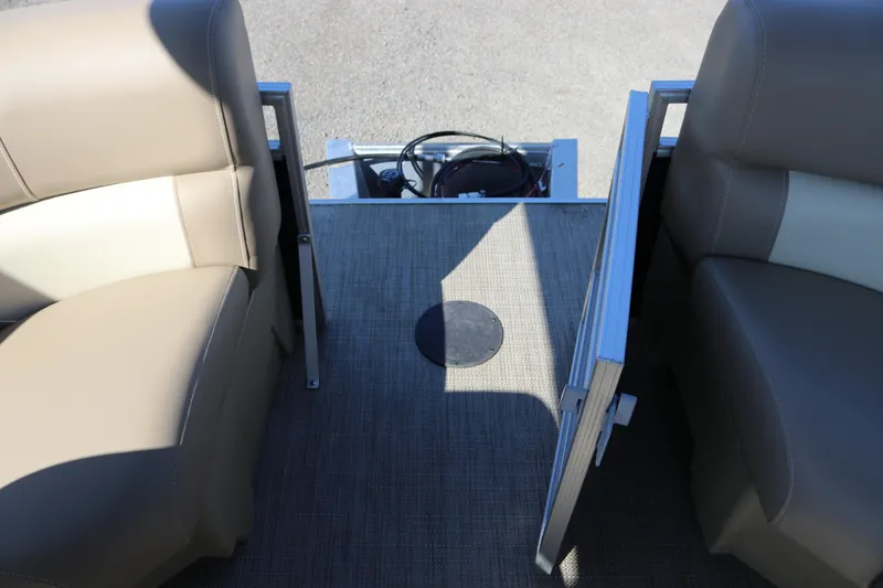 Slide: The Image of Interior view of 2025 Sun Chaser Vista Fish 18 pontoon boat with beige seating. - 21