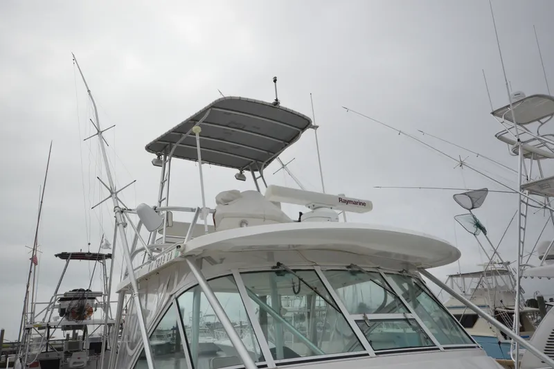 Slide: The Image of 2004 Luhrs 320 Open boat with radar and fishing equipment at marina. - 5