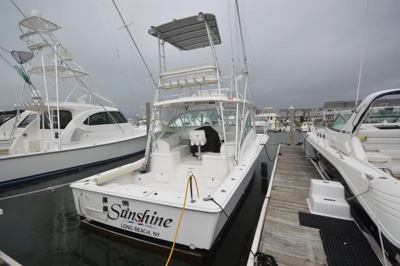 Slide: The Image of 2004 Luhrs 320 Open boat docked in Long Beach, NY marina. - 2