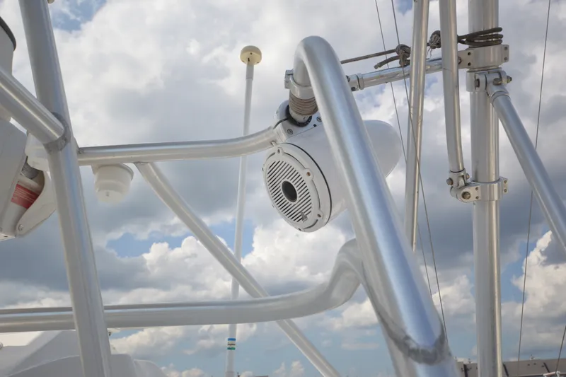 Slide: The Image of Close-up of 2004 Luhrs 320 Open boat's metal framework against cloudy sky. - 33