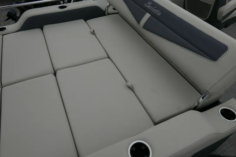 Slide: The Image of 2023 Barletta Cabrio C22UC boat interior with comfortable seating and cup holders. - 12