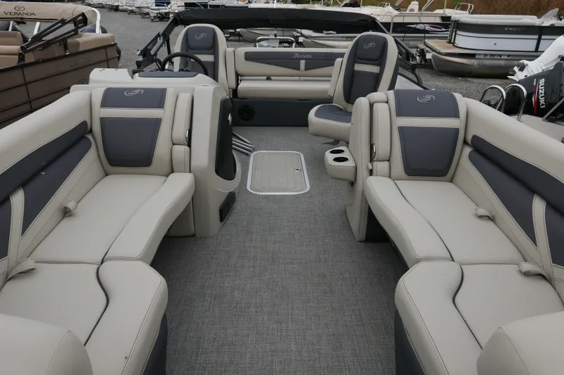 Slide: The Image of 2023 Barletta Cabrio C22UC pontoon boat interior with luxurious seating and modern design. - 4