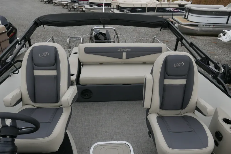 Slide: The Image of 2023 Barletta Cabrio C22UC pontoon boat interior with plush seating and modern design. - 8