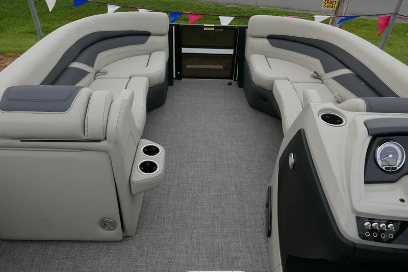 Slide: The Image of 2023 Barletta Cabrio C22UC pontoon boat interior with plush seating and modern dashboard. - 7