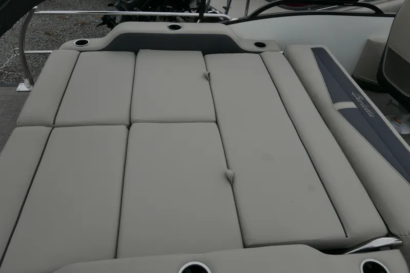 Slide: The Image of 2023 Barletta Cabrio C22UC boat with spacious, cushioned seating area and cup holders. - 14