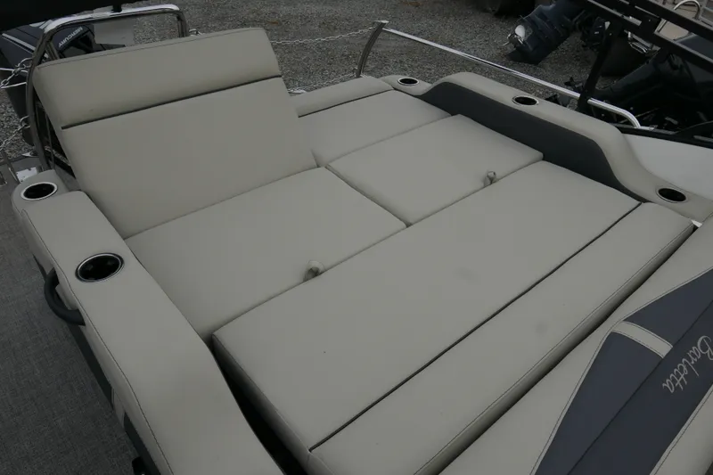 Slide: The Image of 2023 Barletta Cabrio C22UC boat with spacious, cushioned seating and cup holders. - 15