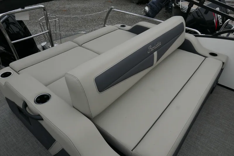 Slide: The Image of 2023 Barletta Cabrio C22UC boat interior seating with cup holders, showcasing luxury design. - 11