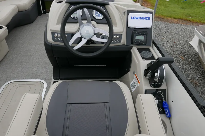 Slide: The Image of 2023 Barletta Cabrio C22UC boat helm with steering wheel and control panel. - 10
