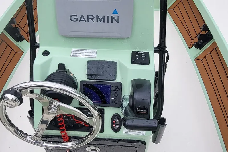 Slide: The Image of Control panel of 2019 Maverick Mirage 18 HPX-V boat with Garmin navigation system. - 16