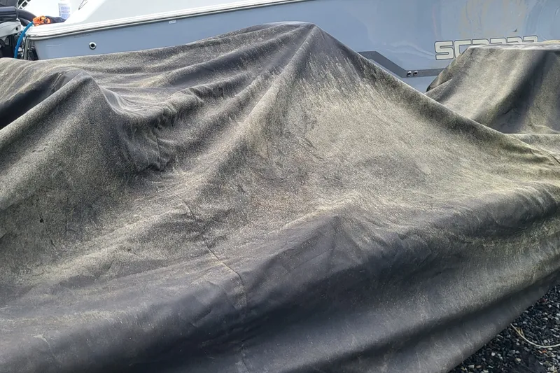 Slide: The Image of Covered 2019 Maverick Mirage 18 HPX-V boat with protective tarp. - 18