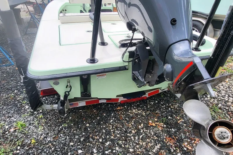 Slide: The Image of 2019 Maverick Mirage 18 HPX-V boat with outboard motor on a trailer. - 8