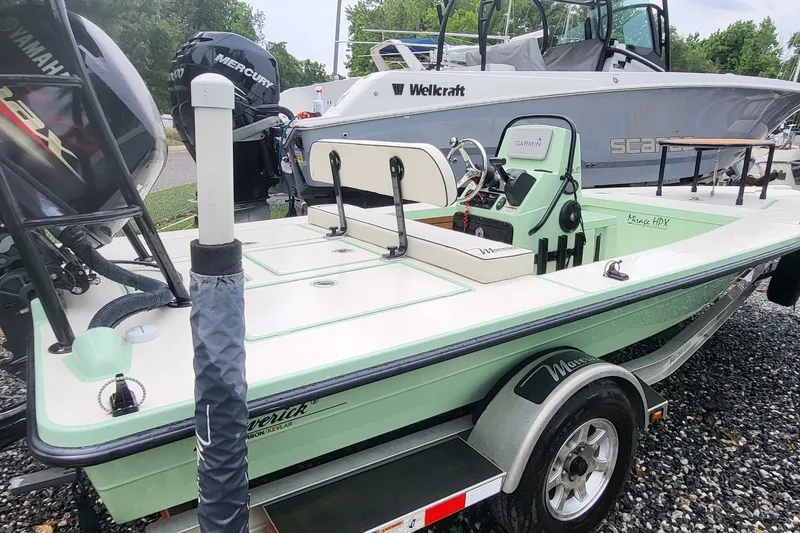 Slide: The Image of 2019 Maverick Mirage 18 HPX-V boat on trailer, featuring Yamaha and Mercury engines. - 2