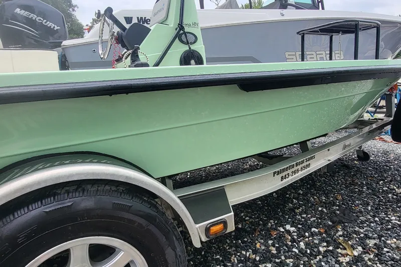 Slide: The Image of 2019 Maverick Mirage 18 HPX-V boat on trailer, side view, green hull. - 5