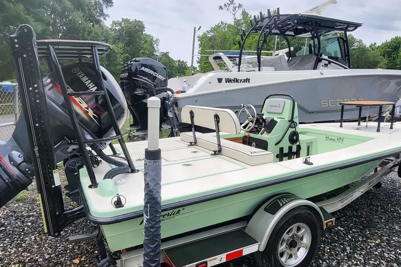 Slide: The Image of 2019 Maverick Mirage 18 HPX-V boat with Yamaha and Mercury engines, parked on a trailer. - 3