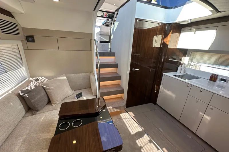 Slide: The Image of Luxurious interior of 2026 Fairline Targa 47 GT yacht with modern kitchen and seating area. - 35