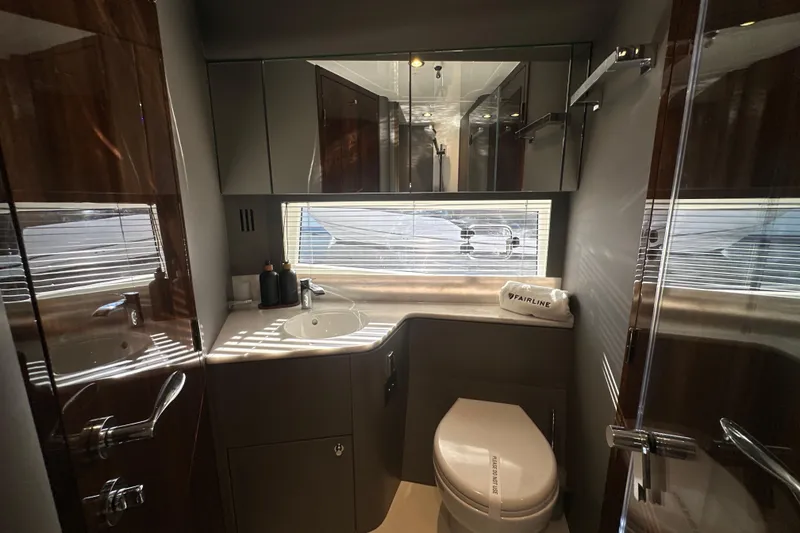 Slide: The Image of Luxurious bathroom interior of 2026 Fairline Targa 47 GT yacht, featuring modern fixtures and elegant design. - 33