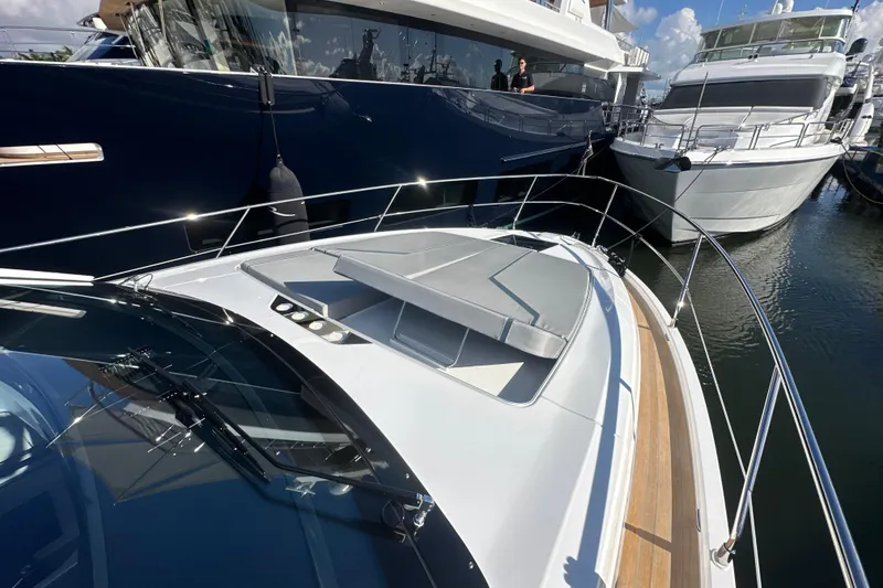 Slide: The Image of 2026 Fairline Targa 47 GT yacht docked, showcasing sleek design and spacious deck. - 51