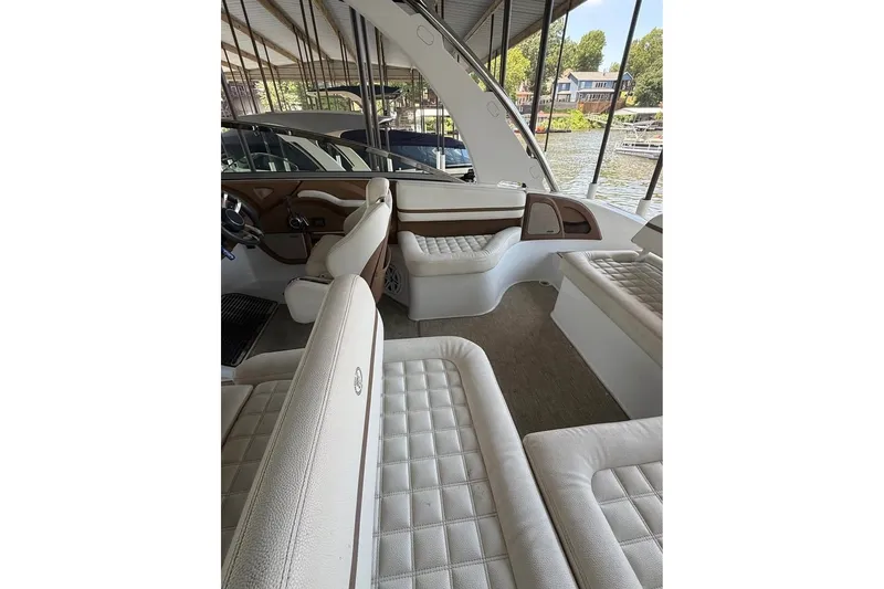 Slide: The Image of 2018 Cobalt R5 boat interior with luxurious white seating and elegant design. - 7