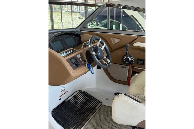 Slide: The Image of 2018 Cobalt R5 boat cockpit with steering wheel and control panel. - 12