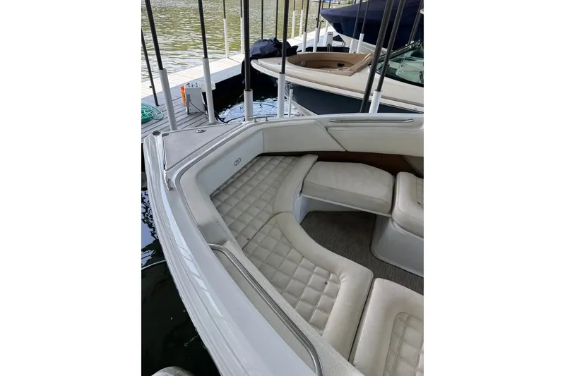 Slide: The Image of 2018 Cobalt R5 boat interior with plush seating at a dock. - 13