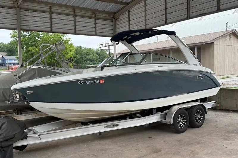 The Image of 2018 Cobalt R5 boat on trailer under shelter, side view. - 0