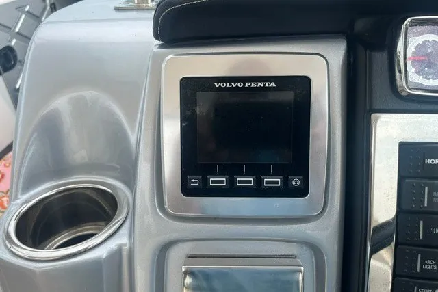 Slide: The Image of Control panel of a 2013 Chaparral 327 SSX boat featuring a Volvo Penta display. - 25