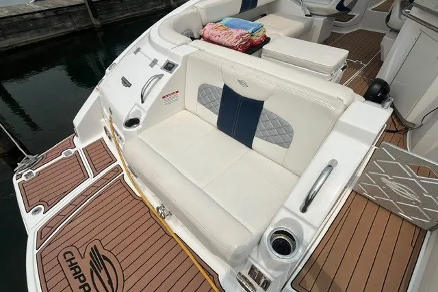 Slide: The Image of 2013 Chaparral 327 SSX boat with white seating and teak-style deck. - 34