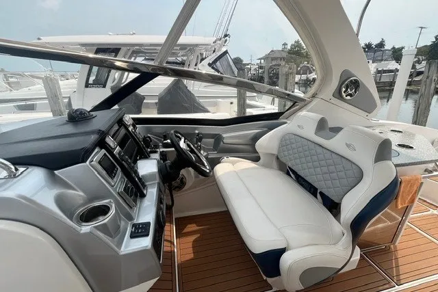 Slide: The Image of 2013 Chaparral 327 SSX boat interior with luxurious seating and modern dashboard. - 15