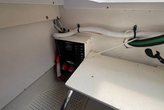 Slide: The Image of 2013 Chaparral 327 SSX boat interior with control panel and wiring. - 11
