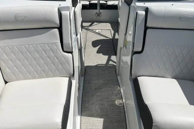 Slide: The Image of Interior of 2022 Crownline 240 SS boat with white leather seating and diamond stitching. - 13