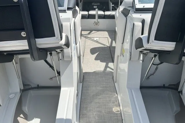 Slide: The Image of 2022 Crownline 240 SS boat interior with seating and walkway. - 7
