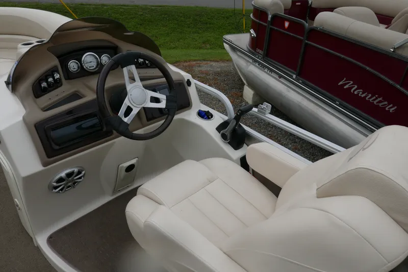 Slide: The Image of 2014 Bennington 2250GSR boat interior with steering wheel and control panel. - 9