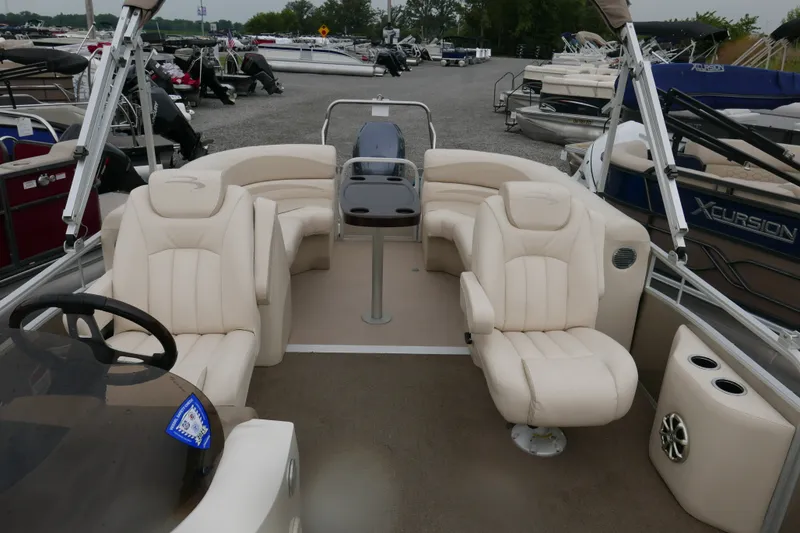 Slide: The Image of 2014 Bennington 2250GSR pontoon boat with beige seating and spacious deck layout. - 8